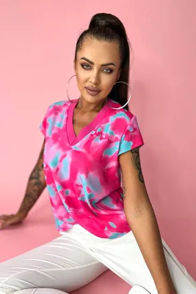 Blusa estiva con maniche corte a fantasia astratta tonalità fucsia e celeste